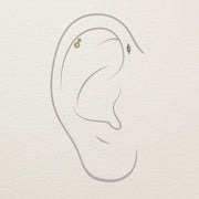 14k gold opal diamond stud end illustrated on helix piercing alongside a marquise ear jewelry companion piece