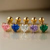 14k yellow gold heart cartilage studs in five colors: pink, blue, clear, purple, and green gemstones