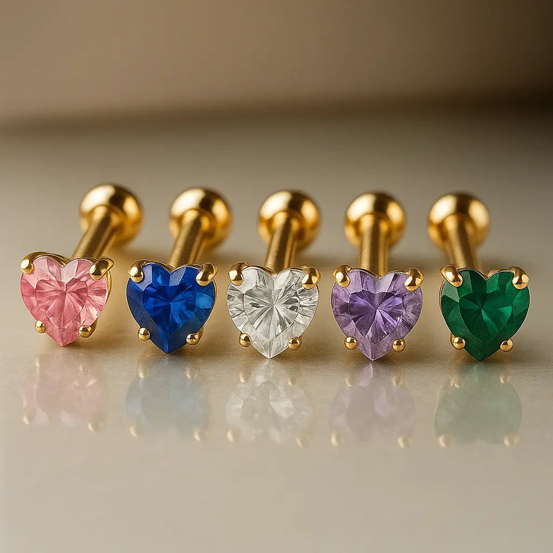 14k yellow gold heart cartilage studs in five colors: pink, blue, clear, purple, and green gemstones