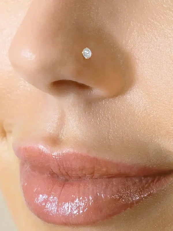 Diamond nose stud worn in a nostril piercing