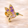 14K yellow gold hummingbird flat back earring with amethyst, pink sapphire, and emerald gems, angled view