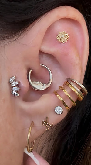 14K gold initial letter flat back stud worn in lower lobe piercing as part of curated ear stack
