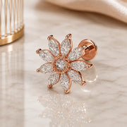 14k rose gold, diamond Jasmine flower flat back stud earring on a glass reflective surface