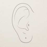 Illustration of opal and diamond gold stud end placed in cartilage and lobe ear piercings
