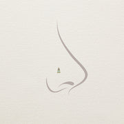 Opal and diamond 14k gold threadless stud end shown on illustrated nose piercing placement