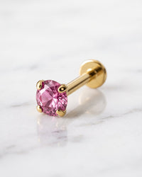 Gemstone lip rings - 14k yellow gold pink sapphire flat back stud on white marble