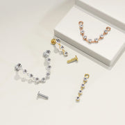 Lyra connector flat back studs disassembled in white gold, yellow gold, and rose gold showing posts and chain