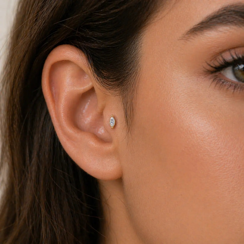 4mm marquise diamond flat back stud worn in a tragus piercing on a model's ear