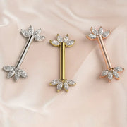 Marquise fan nipple barbells in 14K white, yellow, and rose gold with clear stones on blush satin