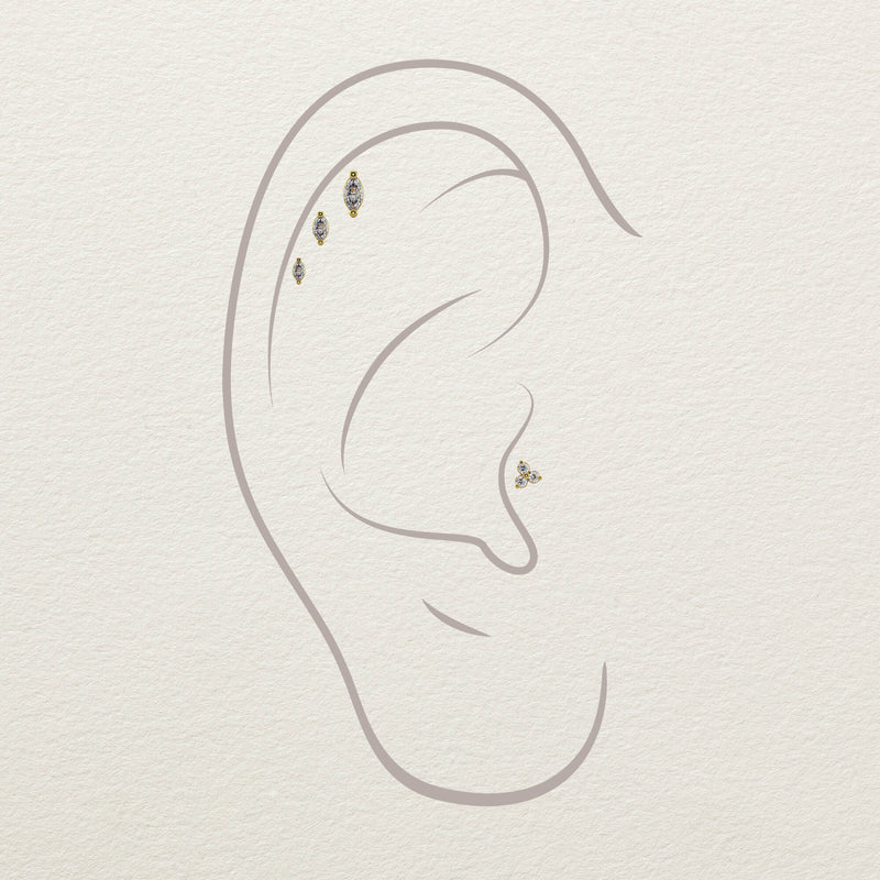 Illustration of marquise diamond stud ends placed in helix and conch piercing positions on ear