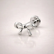 14k white gold bow flat back labret stud, angled view showing sculpted silhouette and flat backing