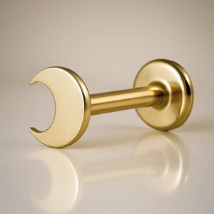 14K yellow gold crescent moon flat back labret, angled view showing post and flat disc backing