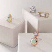 Harmony Duo opal diamond stud end shown in yellow gold, white gold, and rose gold options on display blocks