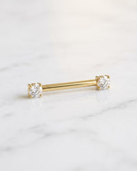 Nipple barbells - 14k yellow gold straight barbell with prong-set diamonds on white marble