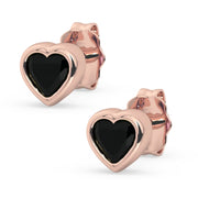 14k rose gold onyx heart stud earrings pair, product render with black gemstones in rose gold bezel setting
