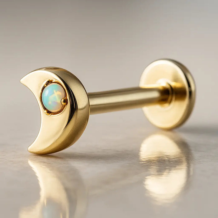 14k yellow gold crescent moon opal flat back labret, angled view showing post and flat disc backing