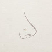 Illustration of 14k gold diamond butterfly threadless end worn as a nose piercing stud, side profile view