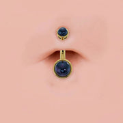 Black Akoya pearl bezel-set 14k gold belly ring shown in navel piercing for fit and scale reference