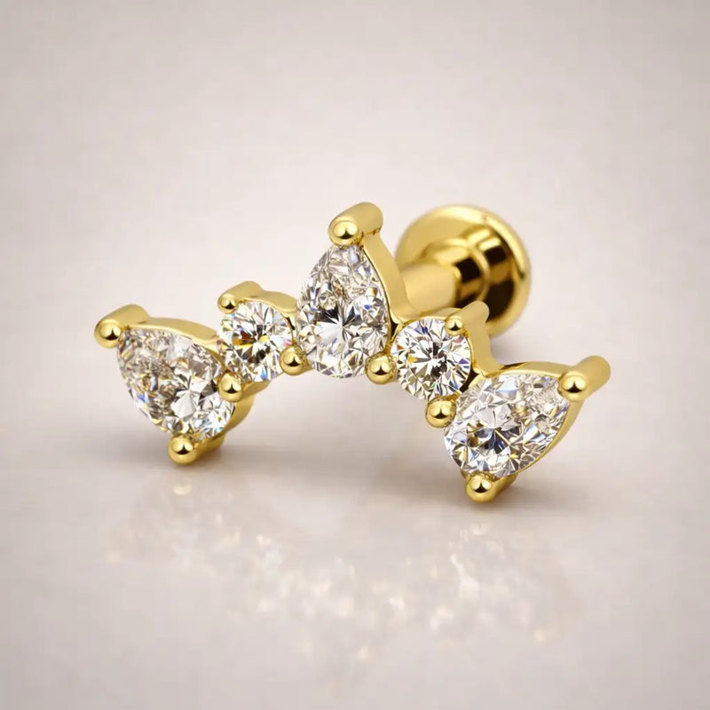 14k yellow gold diamond pear climber flat back stud, angled view showing curved climbing silhouette