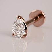 14k rose gold 3mm pear-cut diamond flat back labret stud, angled view highlighting warm gold tone and prongs
