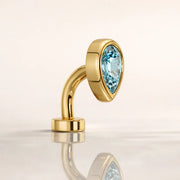 14k yellow gold aquamarine teardrop floating navel ring, angled view with reflection