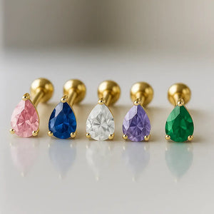 Five pear-cut gemstone flat back studs in 14k gold showing pink, blue, clear, purple, and green color options