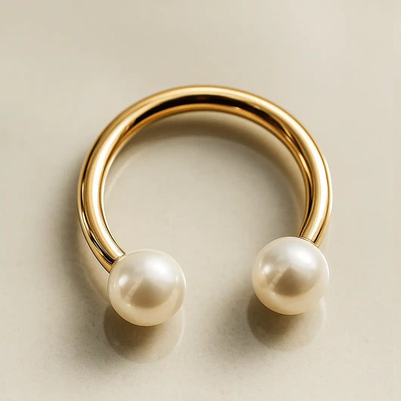 14K yellow gold circular barbell with two cultured white pearls, angled lifestyle shot
