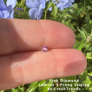 3mm pink diamond piercing stud resting on fingertip outdoors showing true size and sparkle