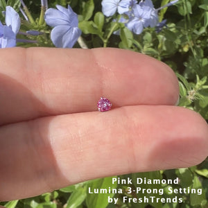 2.5mm genuine pink diamond nose ring end resting on open palm outdoors to show tiny scale