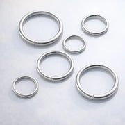 Six platinum seam ring hoops in varying diameters arranged together to show size range