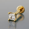 14k yellow gold 2mm princess-cut diamond flat back labret stud, angled product shot on gray surface