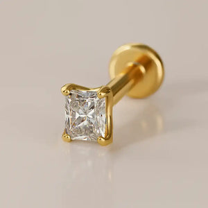 14k yellow gold 2.3mm radiant-cut diamond flat back labret stud, angled studio shot on warm background
