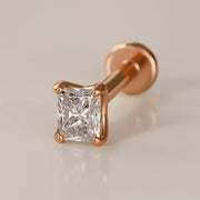 14k rose gold radiant-cut diamond flat back labret stud, angled view showing warm gold prong setting and disc