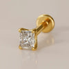 14k yellow gold radiant-cut diamond flat back labret stud, angled view showing four-prong setting and disc