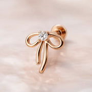 14k rose gold ribbon bow diamond flat back stud, angled view showing warm rosy finish