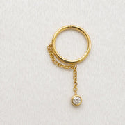 Yellow gold shanty seam ring with a diamond on a white surface lifestyle image.