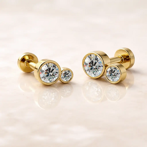 14k yellow gold diamond bubble flat back studs, small and large sizes shown side by side on marble surface