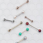 Assortment of straight barbell nipple rings in rose gold, white gold, and yellow gold with opal and pearl ends
