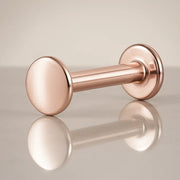 14K rose gold polished disc flat back labret stud, angled view showing warm pink-gold tone