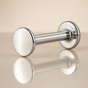 14K white gold polished disc flat back labret stud, angled view on reflective surface