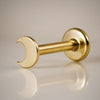 14k yellow gold crescent moon flat back labret stud, angled view showing post and flat disc backing