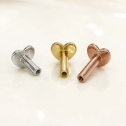 Three heart-shaped replacement threaded post backings displayed on a clean white surface.