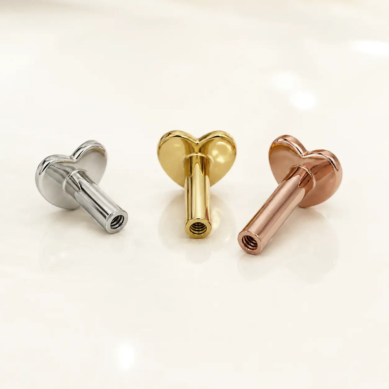 Three heart-shaped replacement threaded post backings displayed on a clean white surface.