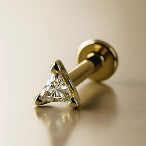 14k yellow gold triangle diamond flat back labret stud, angled view showing post and flat disc backing