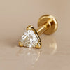 14k yellow gold trillion-cut diamond flat back labret stud, angled studio shot showing prong setting