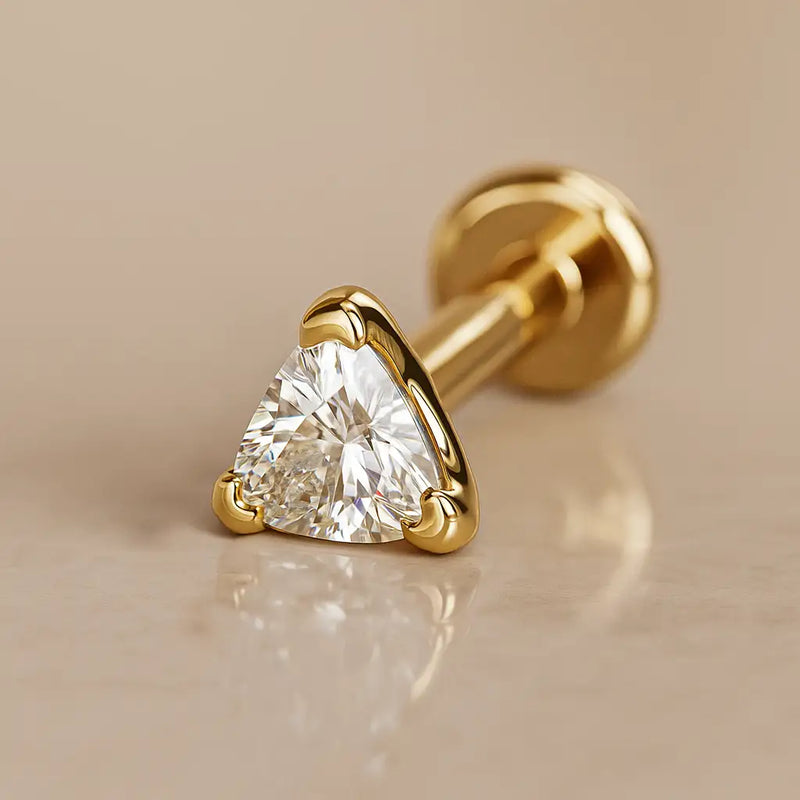 14k yellow gold trillion-cut diamond flat back labret stud, angled studio shot showing prong setting