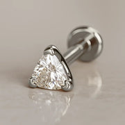 14k white gold 3mm trillion diamond flat back labret stud, angled lifestyle shot on neutral surface