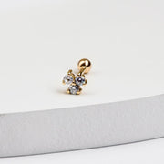 14k yellow gold triple diamond cluster stud with ball back, displayed on white surface edge
