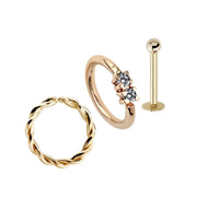 14k gold piercing jewelry gift set with twisted seam ring, CZ double-stone ring, and flatback labret stud