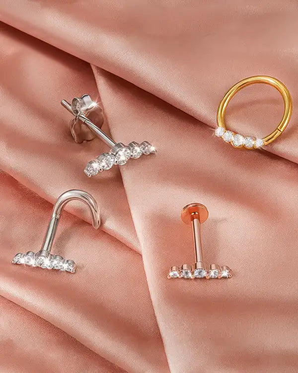 Mini climber jewelry styles on pink satin